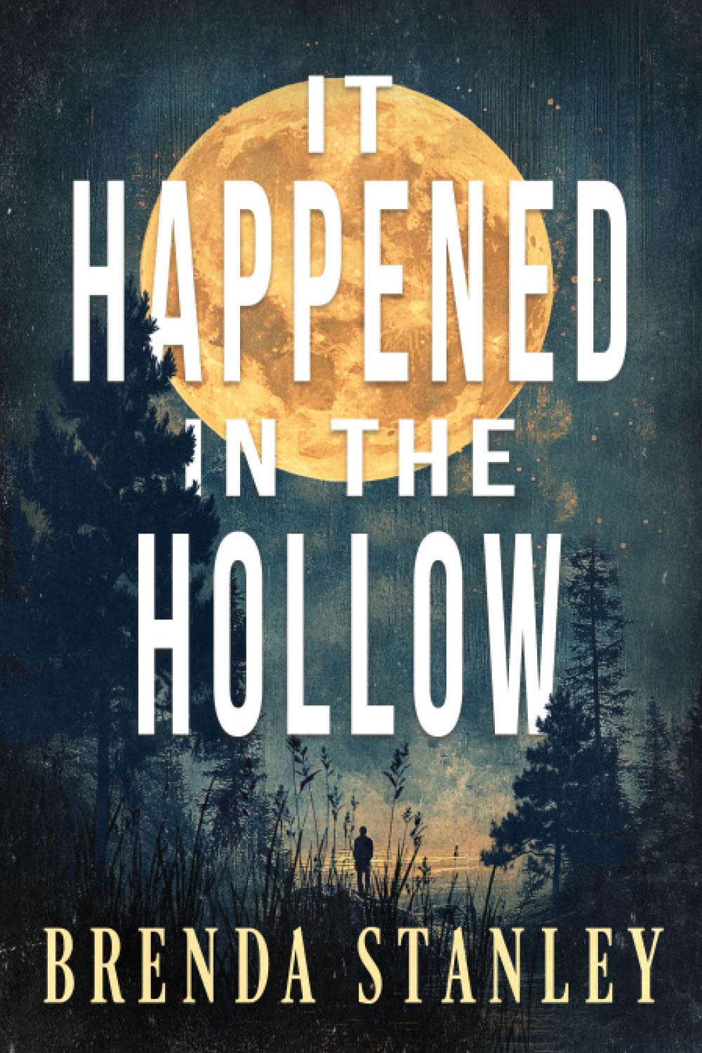 A mystery book cover titled "It Happened in the Hollow" by Brenda Stanley, featuring a large orange moon over a dark, silhouetted forest.
