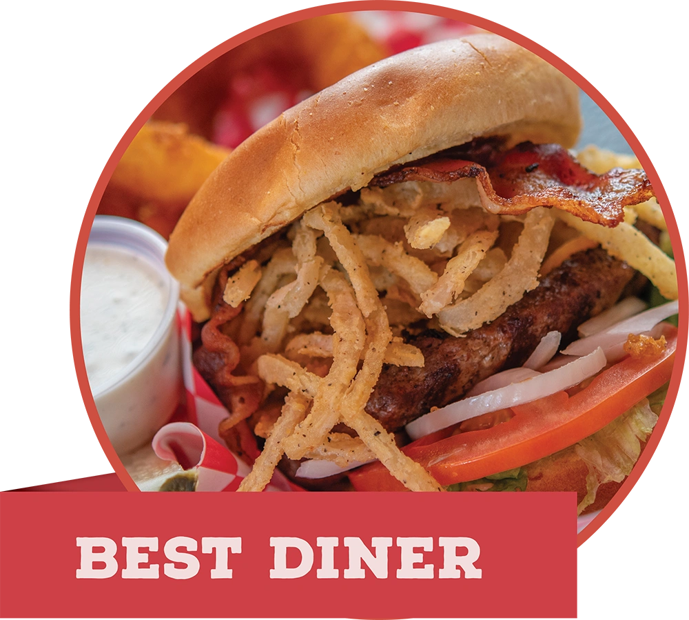 Close-up of a gourmet burger topped with crispy fried onion straws and bacon, with a red banner reading "BEST DINER."