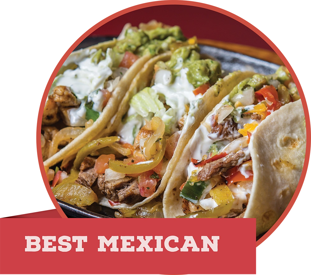 Close-up of loaded chicken and steak street tacos with guacamole, featuring a red banner reading "BEST MEXICAN."